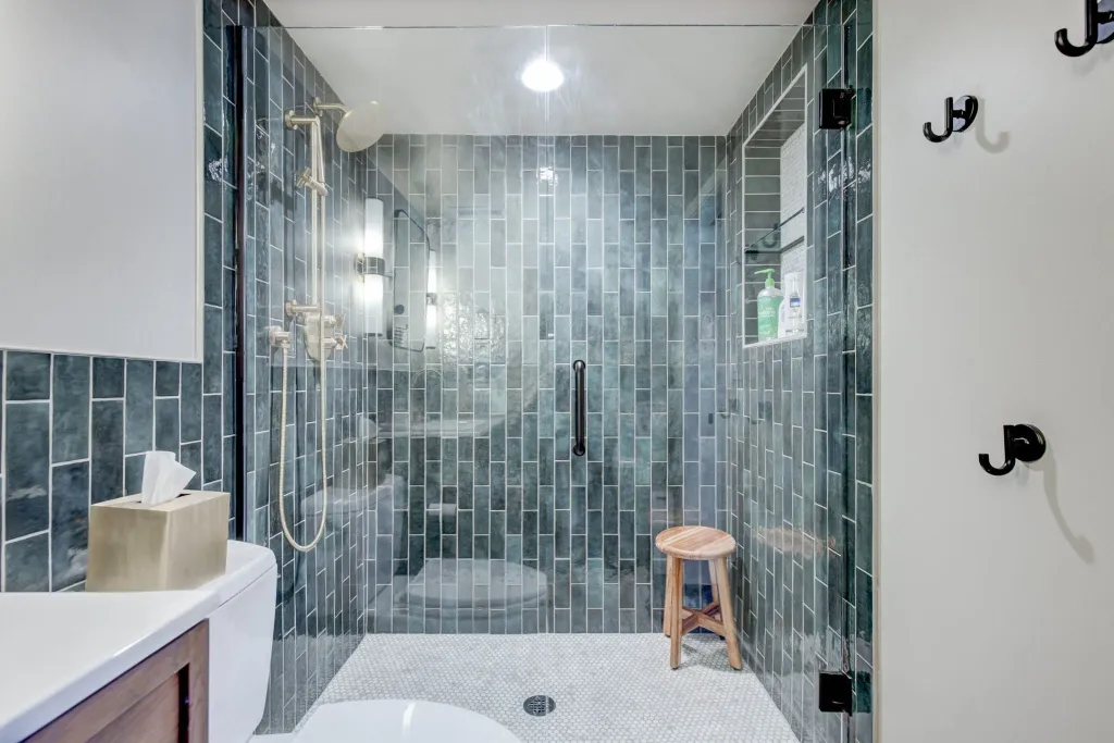 Modern bathroom with custom tile and contemporary fixtures